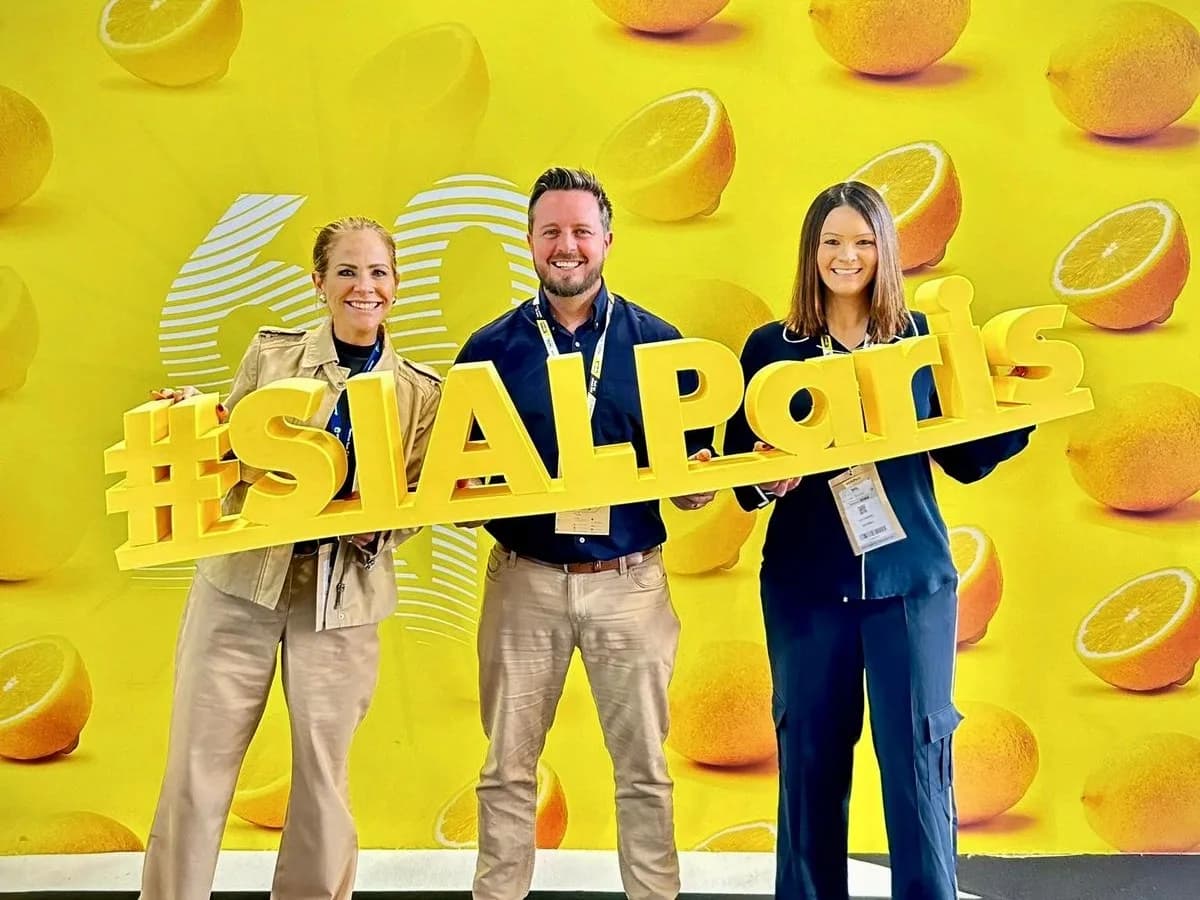The American Foods team at SIAL Paris holding the #SIALParis sign